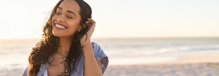 Chiropractic Superior WI Happy Woman On The Beach