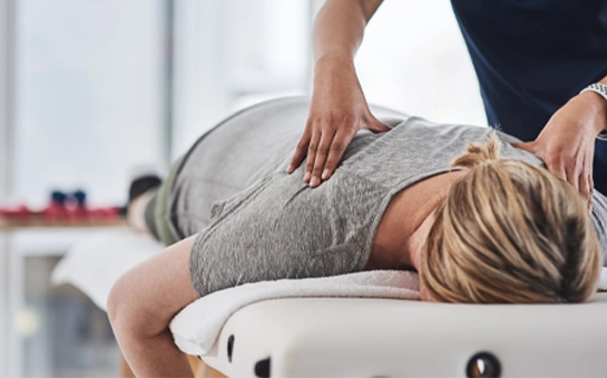 Chiropractic Superior WI Woman Receiving Adjustment